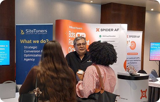 Marty Greif talking to people at a conference